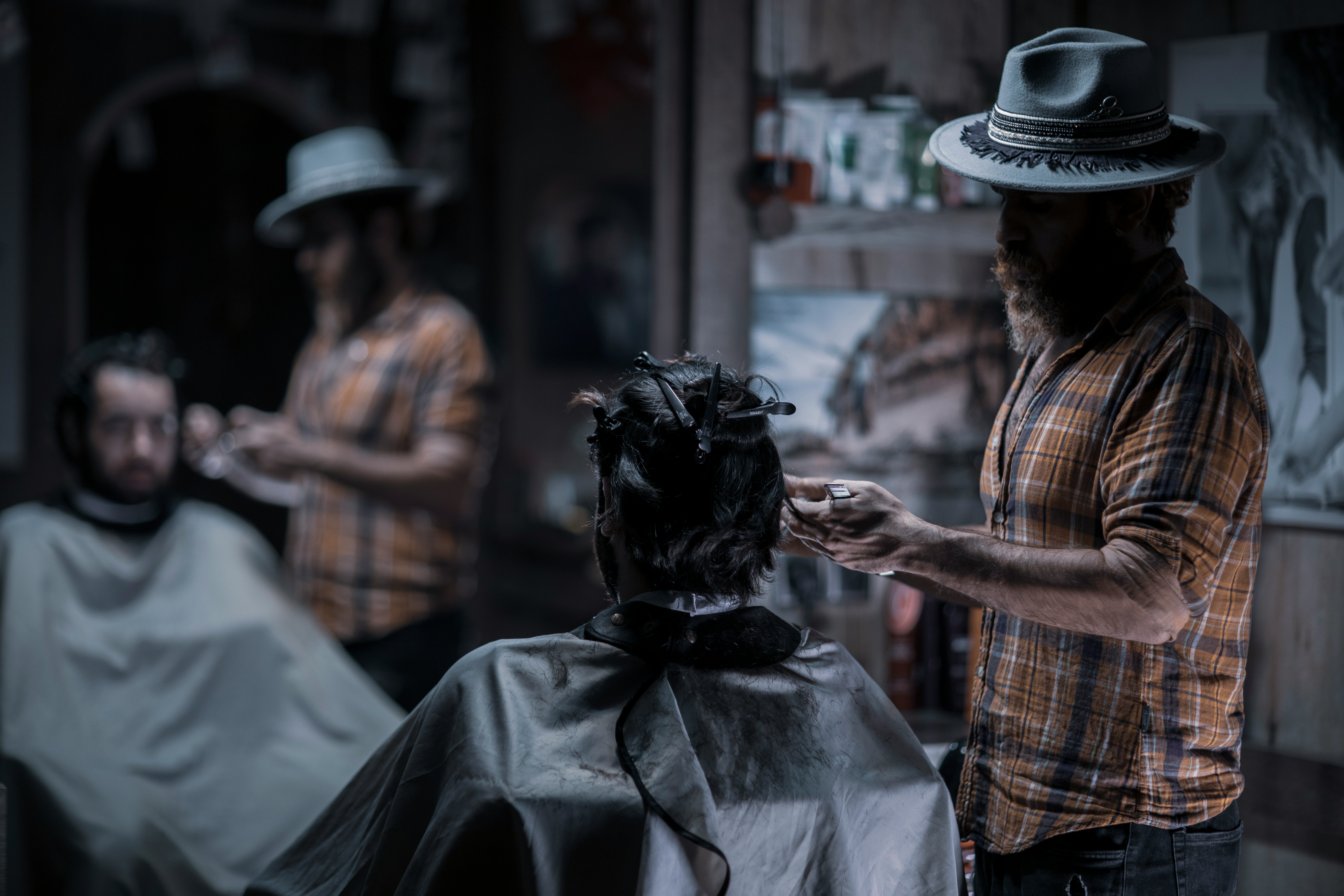 Customer being served at a modern barbershop booked through TressTime