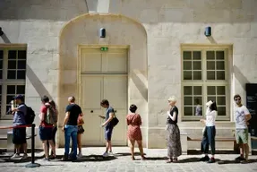 Customers waiting in a long queue